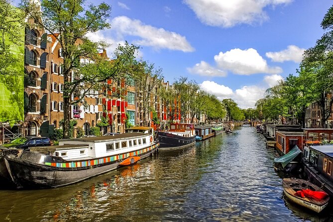 Amsterdam Day Trip from Brussels With Cheese, Clogs and Windmills - Entering Amsterdam by coach