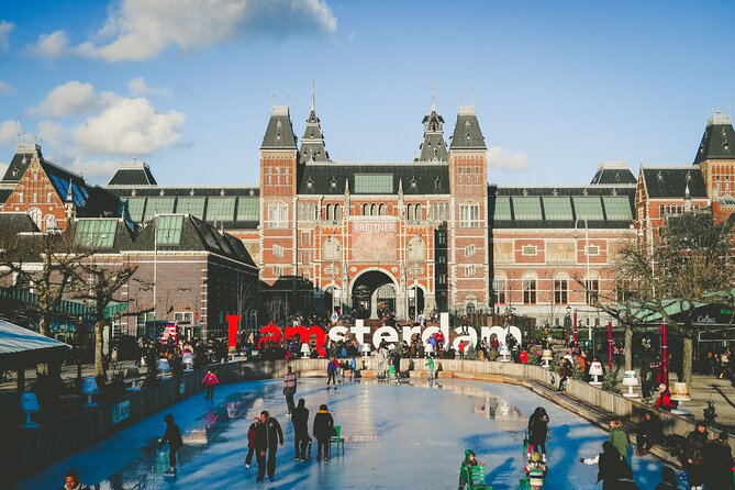 Amsterdam Day Trip from Brussels With Cheese, Clogs and Windmills - Dam Square, the Royal Palace, and Amsterdam’s old center