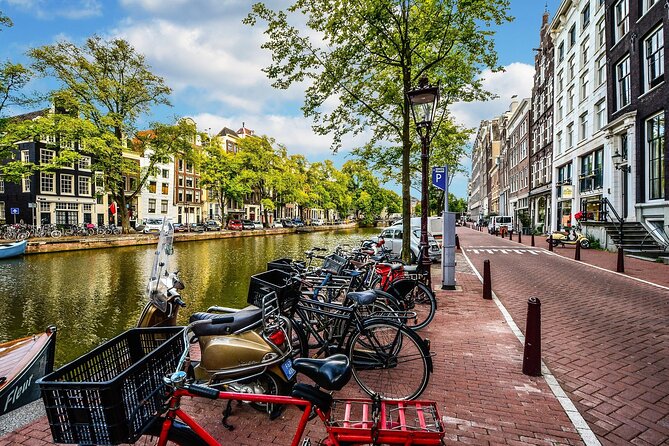 Amsterdam Day Trip from Brussels With Cheese, Clogs and Windmills - Canals, the red light district, and independent sightseeing