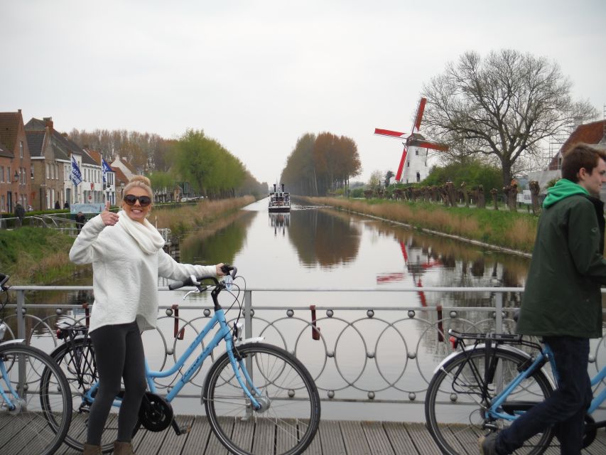 Bruges: Flatlands Guided Bike Tour - The canals and the road toward the Dutch border