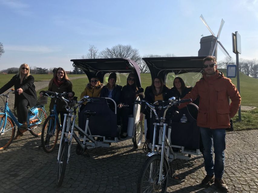Bruges: Private Guided Tour by Pedicab - Canals, medieval buildings, and photo stops