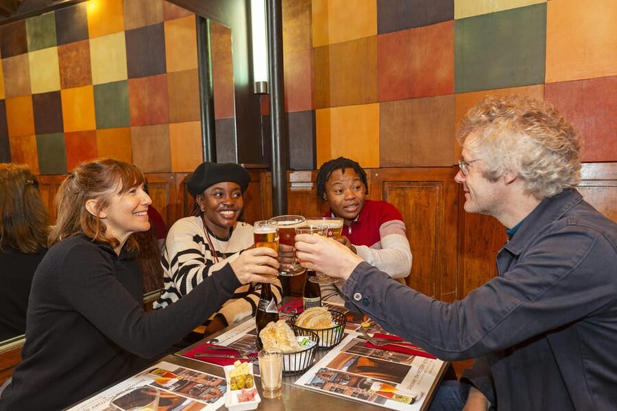 Brussels Food Tour: Main Dish, Beer, Waffle & Chocolate - Starting at Place Poelaert and entering the Marolles