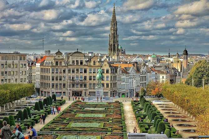 Brussels Private Walking Tour With A Professional Guide - Historic shop fronts and a city shaped by conflict