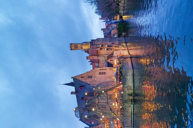 Evening Delights: Bruges Tour with Beer & Chocolate - Belfort explains the city’s watchtower