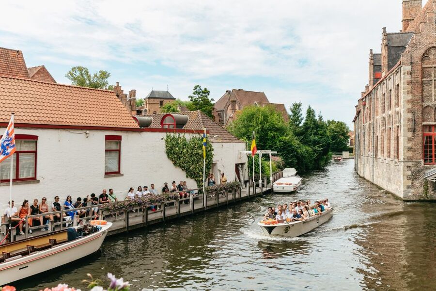 From Brussels: Guided Day Trip to Bruges and Ghent - St. Nicholas’ Church and Graslei show Ghent’s character