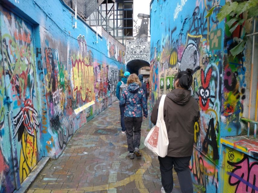 Ghent: Guided City Highlights Walking Tour with Light Meal - Graffiti Street and the city beyond the postcard
